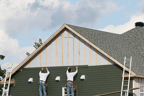 Professional Siding Installation technician working in Portland, OR